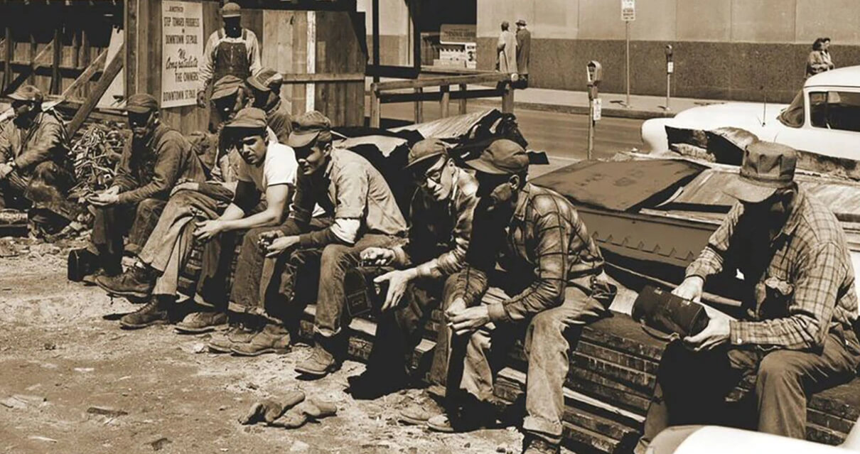 Men sitting at a building site