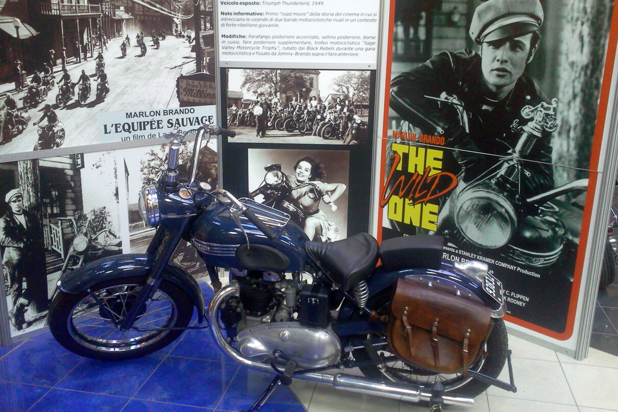 A display showing the poster of The Wild One starring Marlon Brando with the Triumph Thunderbird motorcycle